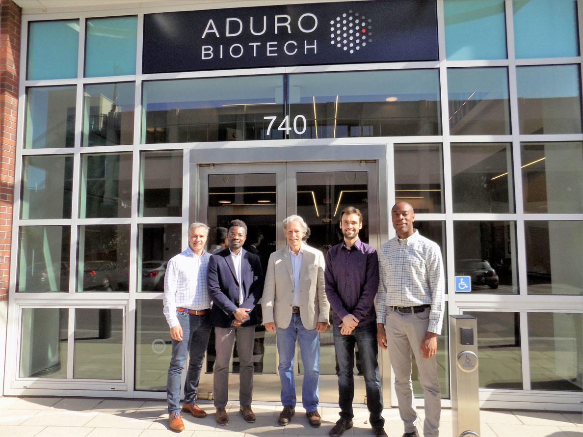College of Chemistry and Aduro Biotech staff stand in front of the company entrance