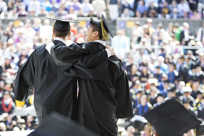 Graduating students celebrating at commencement