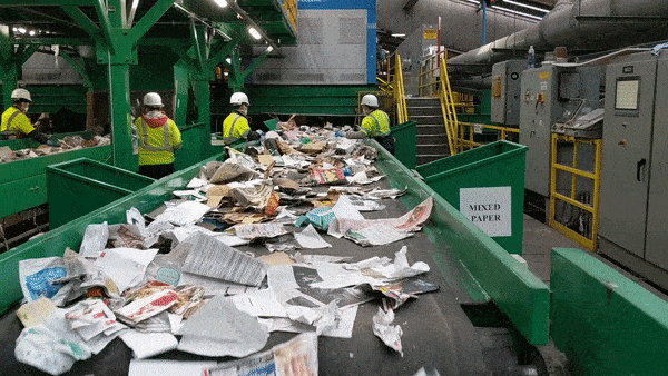 Workers sort recycling in San Francisco