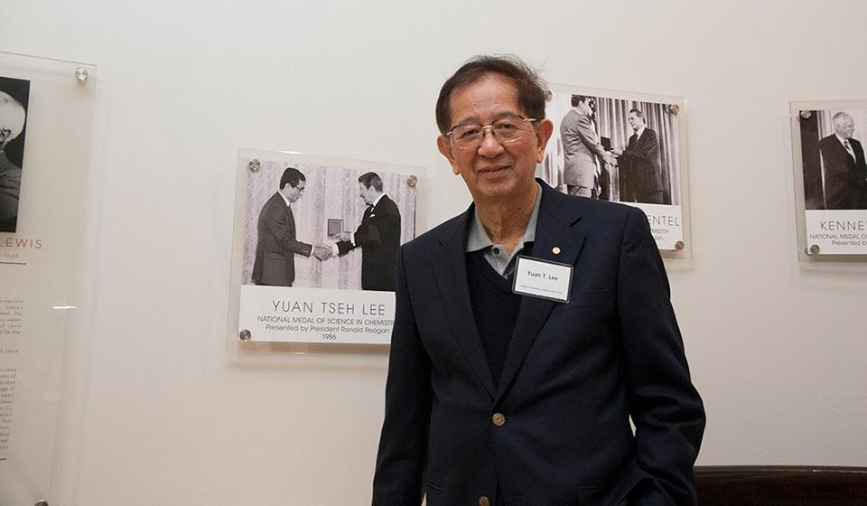 CoC advisory board member and Nobel Laureate Y.T. Lee poses next to the plaque in the Latimer stairwell honoring his National Medal of Science.