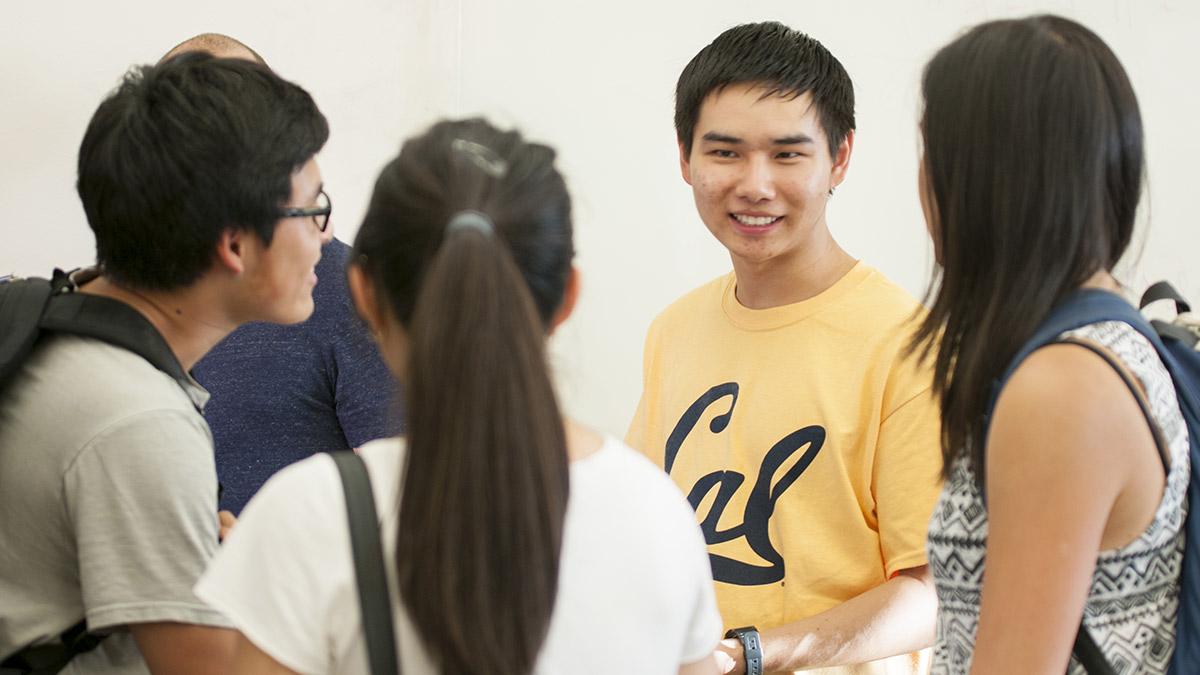 A group of students talking and laughing