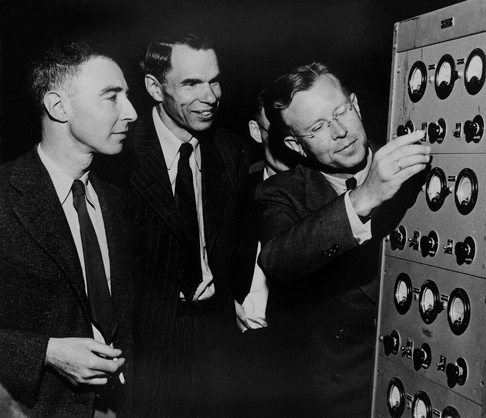 Ernest O. Lawrence, Glenn T. Seaborg, and J. Robert Oppenheimer in early 1946 at the controls to the magnet of the 184-inch cyclotron