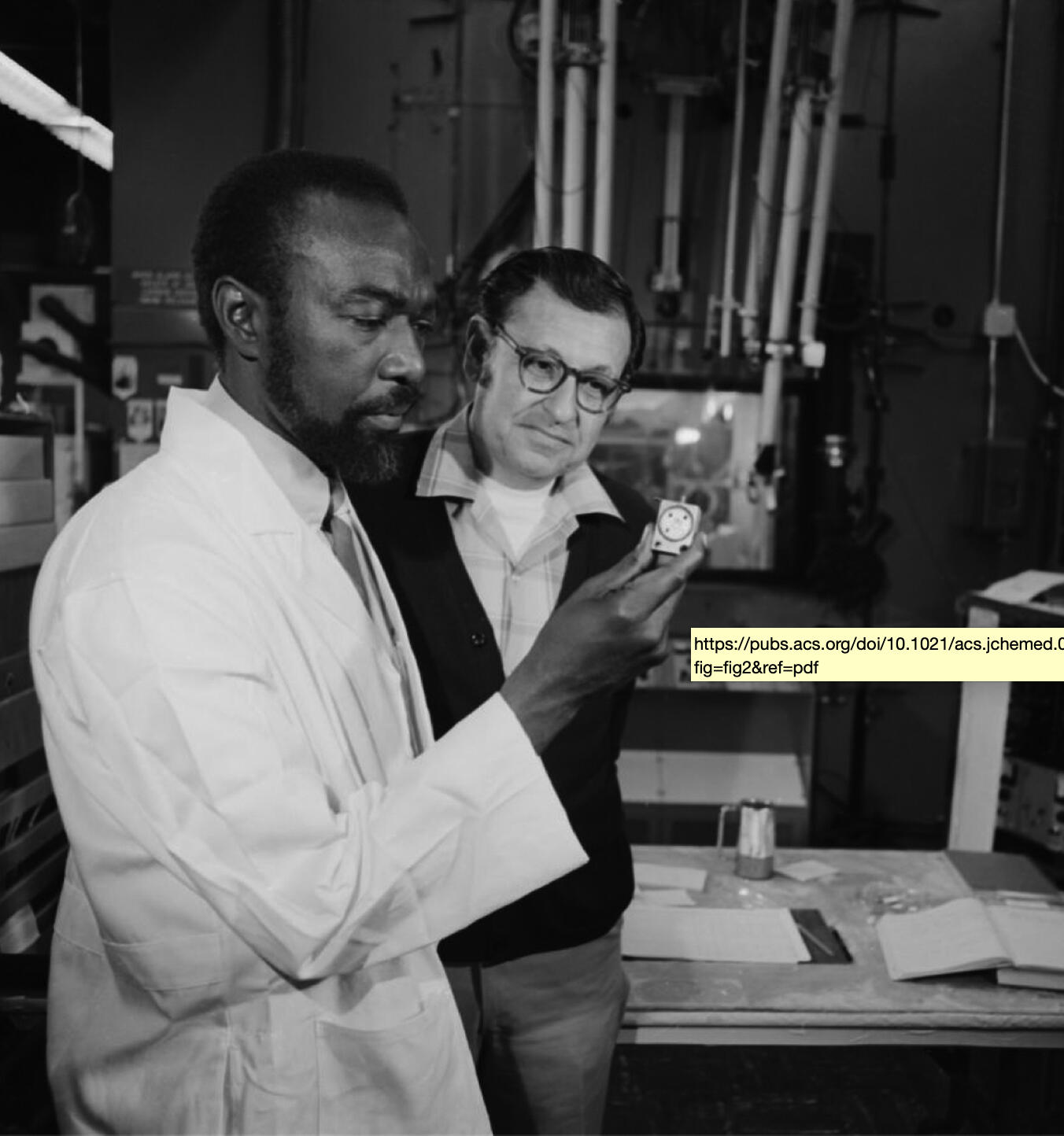 James Harris (left) and Albert Ghiorso with the target used to create isotopes of elements 104 and 105 in Berkeley Lab’s Heavy Ion Linear Accelerator. April 21, 1970.