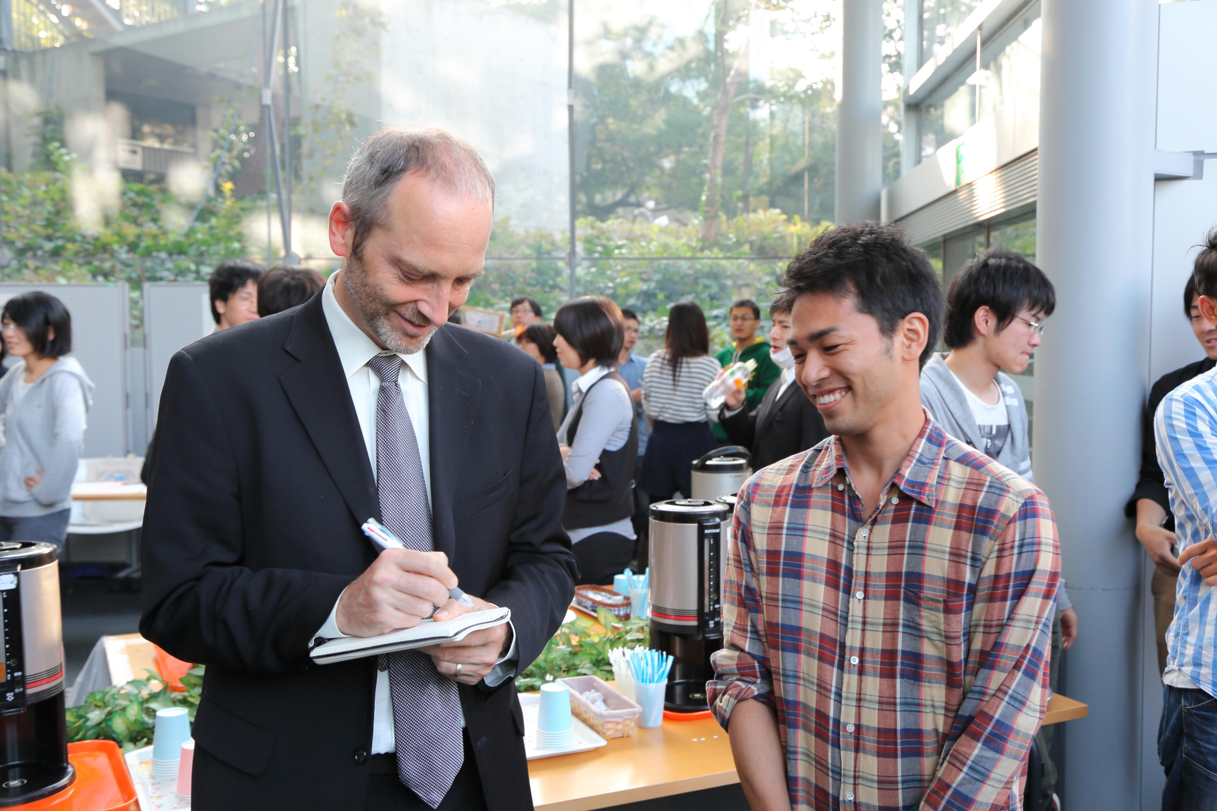 Prof. John Hartwig with student at event