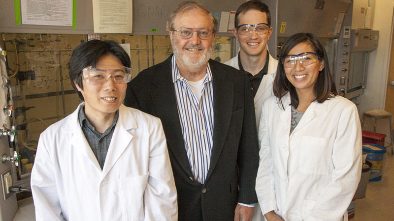 Ken Raymond with research group members in 2013.