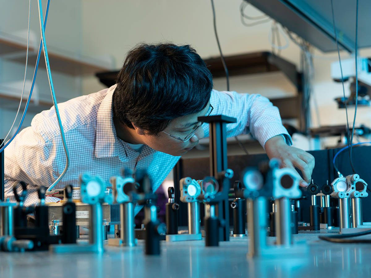 Ke Xu in his lab where he aims to understand how microscopic molecules move and interact to better understand biological processes. (Photo by Elena Zhukova)