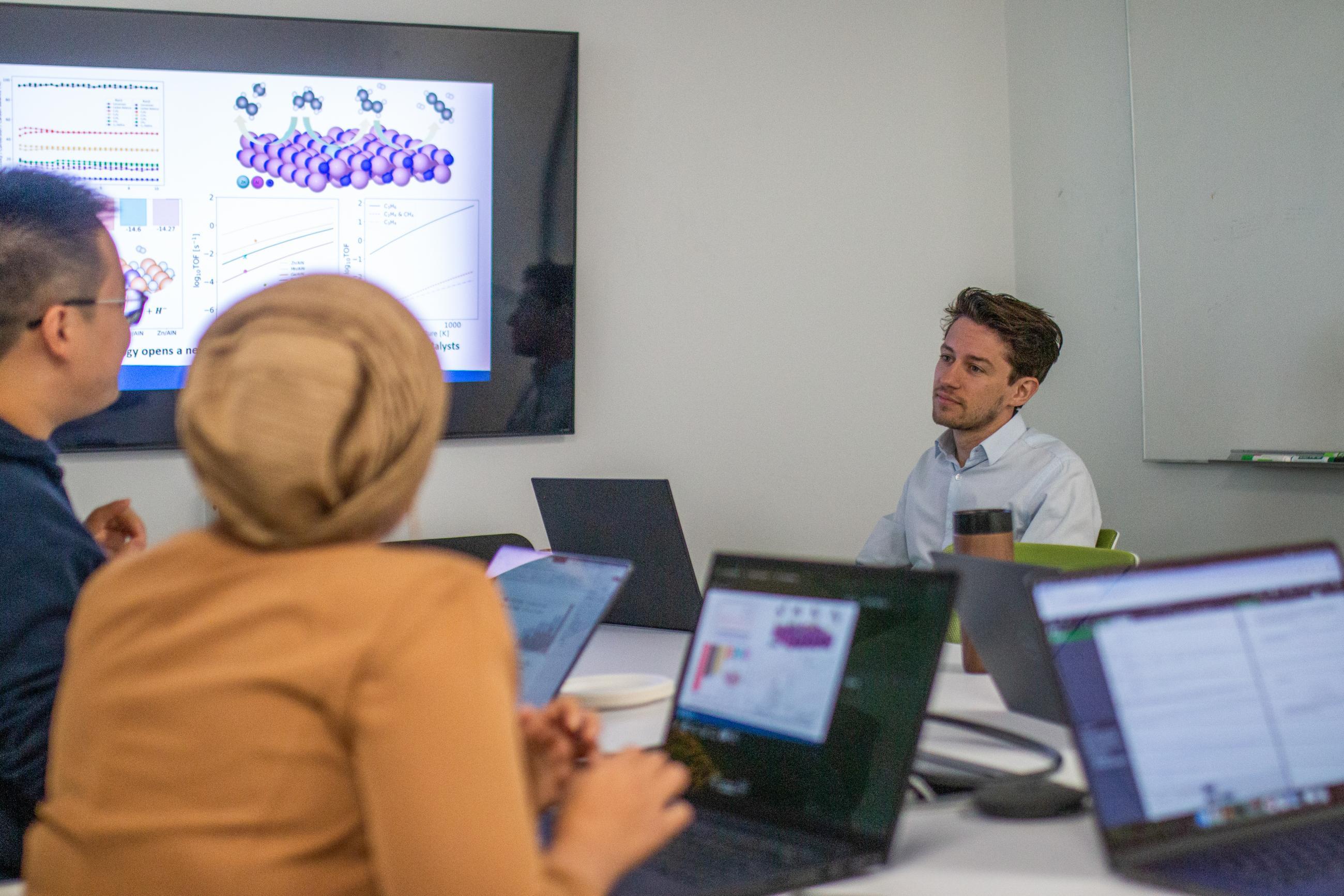 Three people in a meeting