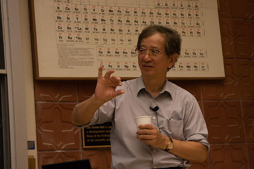 YT Lee in front of periodic table