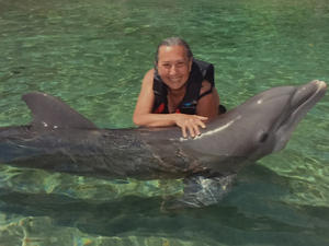 Geralyn Unterberg swimming with dolphins in Hawaii