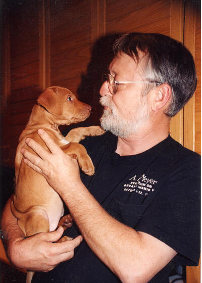 Clayton Heathcock with one of his Rhodesian Ridgebacks